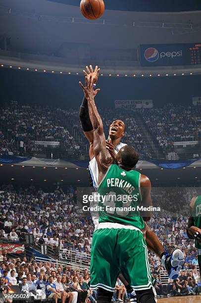 Dwight Howard of the Orlando Magic shoots against Kendrick Perkins of the Boston Celtics in Game One of the Eastern Conference Finals during the 2010...