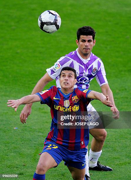 Barcelona's forward Pedro Rodriguez fights for the ball with Valladolid's Brazilian forward Diego Costa during a Spanish League football match...