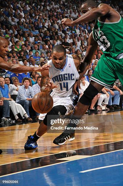 Jameer Nelson of the Orlando Magic drives against Ray Allen and Kendrick Perkins of the Boston Celtics in Game One of the Eastern Conference Finals...