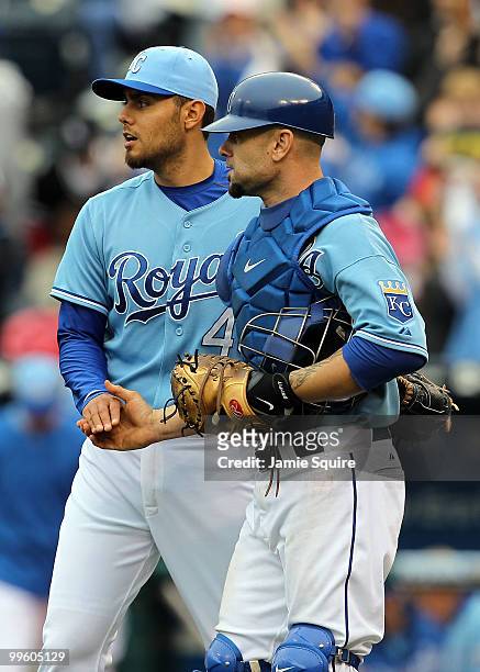 Pitcher Joakim Soria of the Kansas City Royals is congratulates by catcher Jason Kendall after the Royals defeated the Chicago White Sox 5-3 on May...