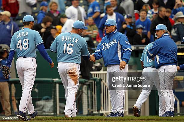 Manager Ned Yost of the Kansas City Royals congratulates players after the Royals defeated the Chicago White Sox 5-3 on May 16, 2010 at Kauffman...