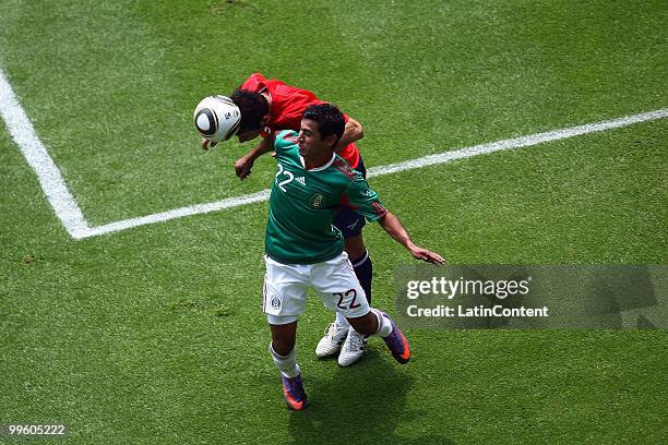 Alberto Medina of Mexico fights for the ball with Ismael Fuentes of Chile, during a friendly match as part of the Mexico National team preparation...