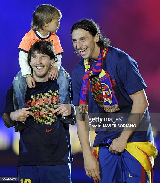 Barcelona's Argentinian forward Lionel Messi and Barcelona's Swedish forward Zlatan Ibrahimovic celebrate after winning their Spanish League football...