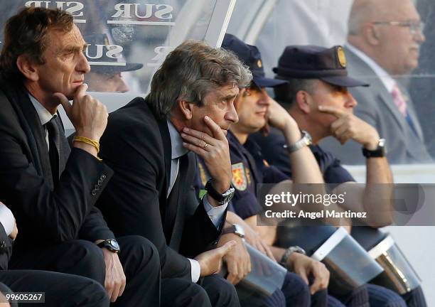 Head coach Manuel Pellegrini of Real Madrid follows his players during the La Liga match between Malaga and Real Madrid at La Rosaleda Stadium on May...