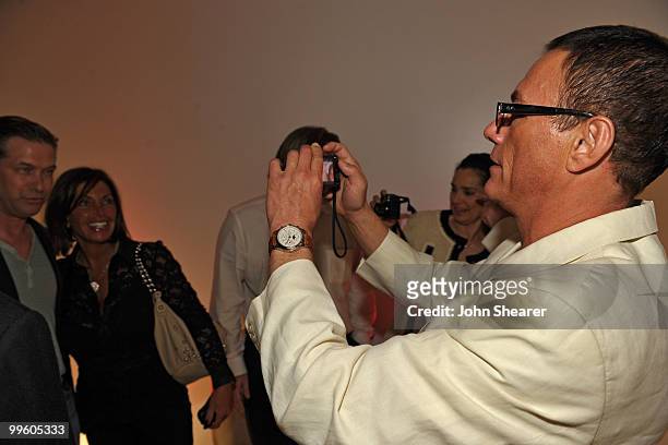 Actor Jean-Claude Van Damme takes a picture of Stephen Baldwin at the Variety Celebrates Ashok Amritraj event held at the Martini Terraza during the...