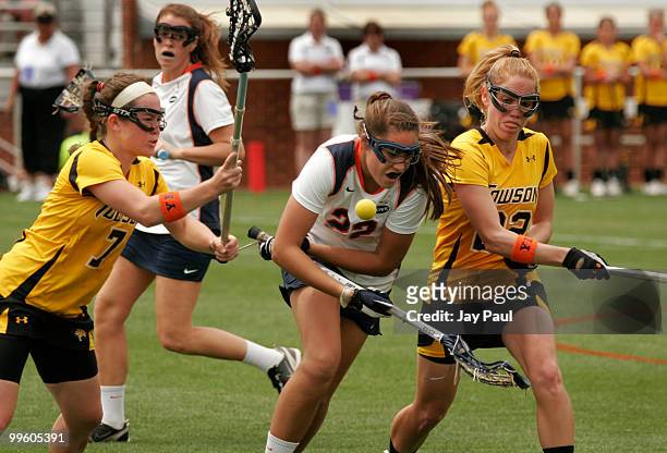 Megan Fitzerald and Steph Taylor of the Towson Tigers battle against Caroline McTierman of the Virginia Cavaliers at Klockner Stadium May 16, 2010 in...