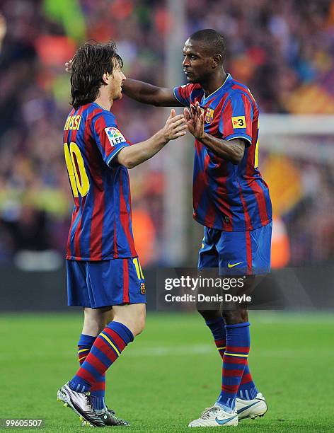 Leo Messi and Eric Abidal celebrate after Barcelona beat Real Valladolid 4-0 to clinch La Liga title after their match at Camp Nou stadium on May 16,...