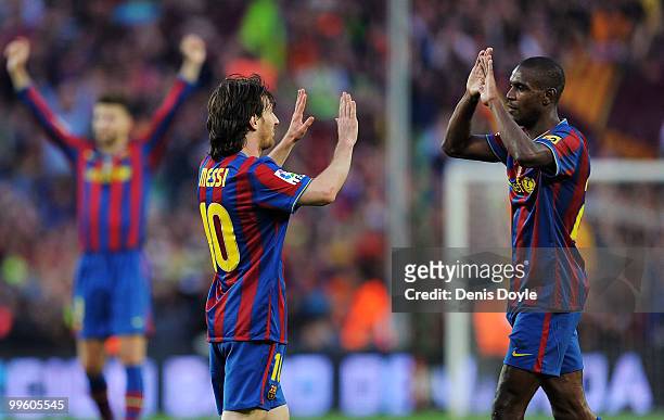 Leo Messi and Eric Abidal celebrate after Barcelona beat Real Valladolid 4-0 to clinch La Liga title after their match at Camp Nou stadium on May 16,...