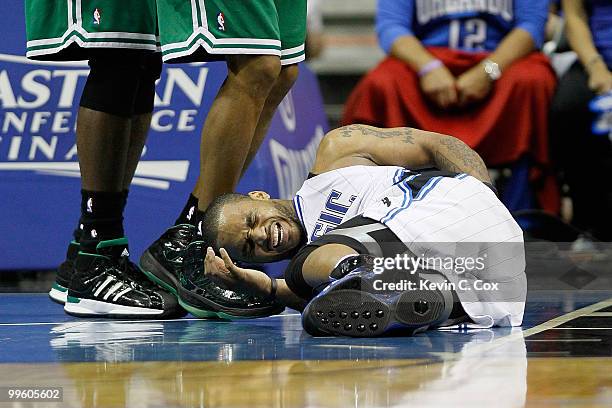 Jameer Nelson of the Boston Celtics grabs his back as he lies on the court in pain against the Orlando Magic against the Boston Celtics in Game One...