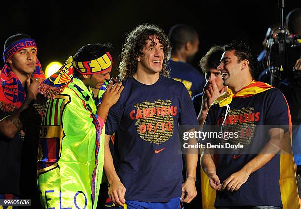 Carles Puyol and Xavi Hernandez of Barcelona celebrate after Barcelona beat Real Valladolid 4-0 to clinch La Liga title after their match at Camp Nou...