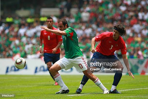 Cuauhtemoc Blanco of Mexico fights for the ball with Waldo Ponce of Chile, during a friendly match as part of the Mexico National team preparation...