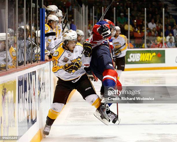 Spencer Metcalfe of the Moncton Wildcats body checks Toni Rajala of the Brandon Wheat Kings during the 2010 Mastercard Memorial Cup Tournament at the...