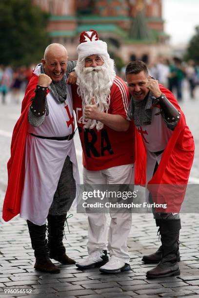 England fans pose with a Russian fan in Red Square ahead of tonight's World Cup semi-final game between England and Croatia on July 11, 2018 in...
