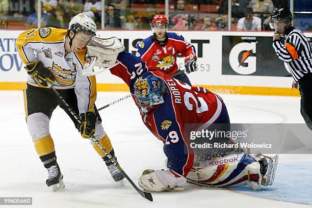 Nicola Riopel of the Moncton Wildcats gets his blocker into the face of Matt Calvert of the Brandon Wheat Kings during the 2010 Mastercard Memorial...