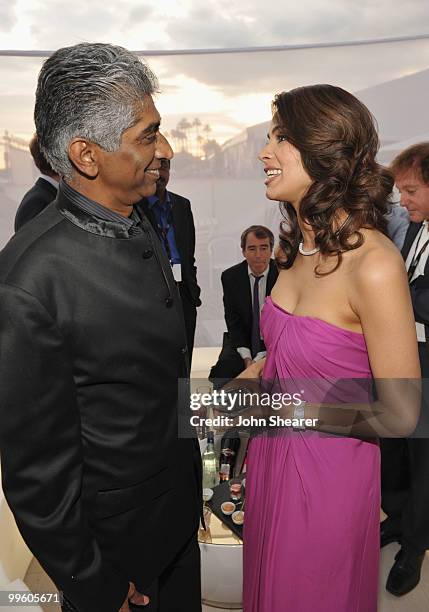 Producer Ashok Amritraj and actress Mallika Sherawat attend the Variety Celebrates Ashok Amritraj event held at the Martini Terraza during the 63rd...