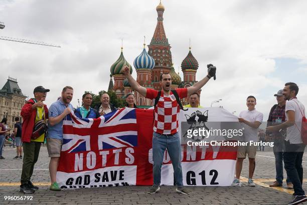 England fans pose with a Croatian fan in Red Square ahead of tonight's World Cup semi-final game between England and Croatia on July 11, 2018 in...