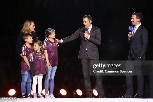 Cameron Smith and his family appear on stage during a "We love Queenslanders" Captain's Tribute during game three of the State of Origin series...