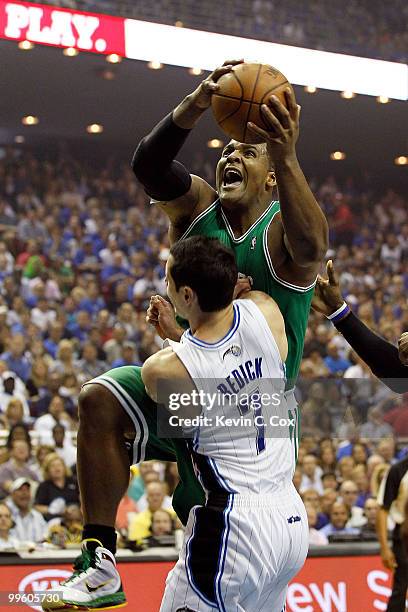 Redick of the Orlando Magic draws an offensive charge against Glen Davis of the Boston Celtics in Game One of the Eastern Conference Finals during...