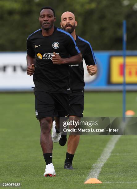 Kwadwo Asamoah and Borja Valero of FC Internazionale run during the FC Internazionale training session at the club's training ground Suning Training...