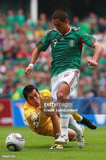 Javier Hernandez of Mexico fights for the ball with Luis Marin of Chile, during a friendly match as part of the Mexico National team preparation for...