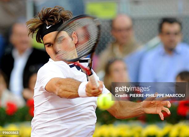 Swiss Roger Federer returns a ball to Spanish Rafael Nadal during their final match of the Madrid Masters on May 16, 2010 at the Caja Magic sports...