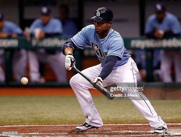 Outfielder Carl Crawford of the Tampa Bay Rays bunts against the Seattle Mariners during the game at Tropicana Field on May 16, 2010 in St....