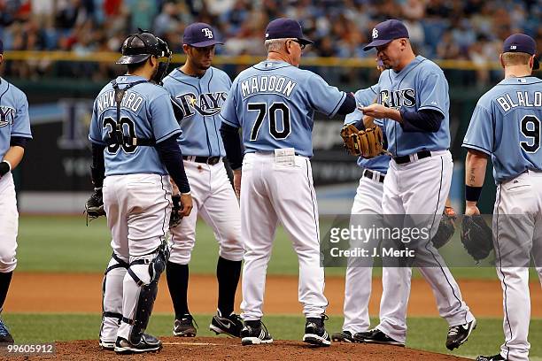 Manager Joe Maddon of the Tampa Bay Rays makes a pitching change against the Seattle Mariners during the game at Tropicana Field on May 16, 2010 in...