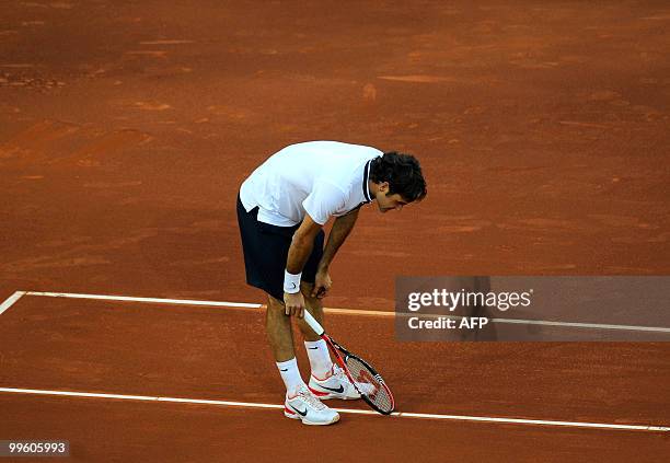 Swiss Roger Federer reacts during the final match of the Madrid Masters against Spain's Rafael Nadal on May 16, 2010 at the Caja Magic sports complex...