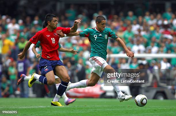 Javier Hernandez of Mexico fights for the ball with Gonzalo Jara of Chile, during a friendly match as part of the Mexico National team preparation...