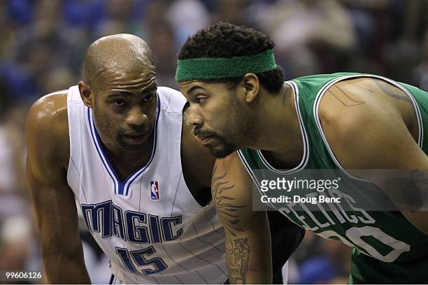 Vince Carter of the Orlando Magic lines up next to Rasheed Wallace of the Boston Celtics as they wait for a free throw attempt in Game One of the...