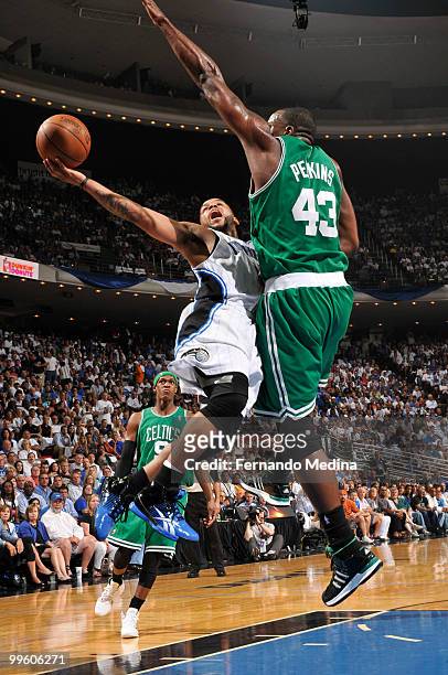 Jameer Nelson of the Orlando Magic shoots against Kendrick Perkins of the Boston Celtics in Game One of the Eastern Conference Finals during the 2010...