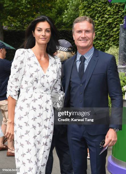 David Coulthard and Karen Minier attend day nine of the Wimbledon Tennis Championships at the All England Lawn Tennis and Croquet Club on July 11,...