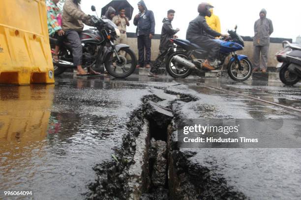 Cracks developed on Saket bridge Thane on Tuesday, following which one lane has been closed for traffic, on July 10, 2018 in Mumbai, India. Heavy...