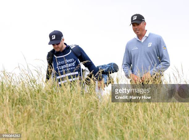 Matt Kuchar of the United States walks off the fifth tee with caddie John Wood during the Pro-Am event of the Aberdeen Standard Investments Scottish...