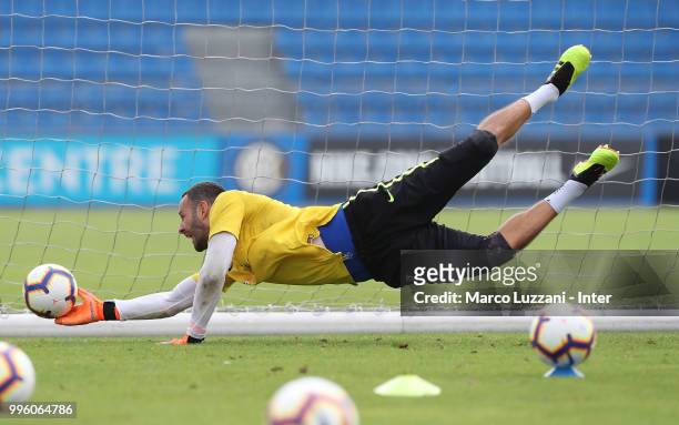 Samir Handanovic of FC Internazionale dives to save a shot during the FC Internazionale training session at the club's training ground Suning...