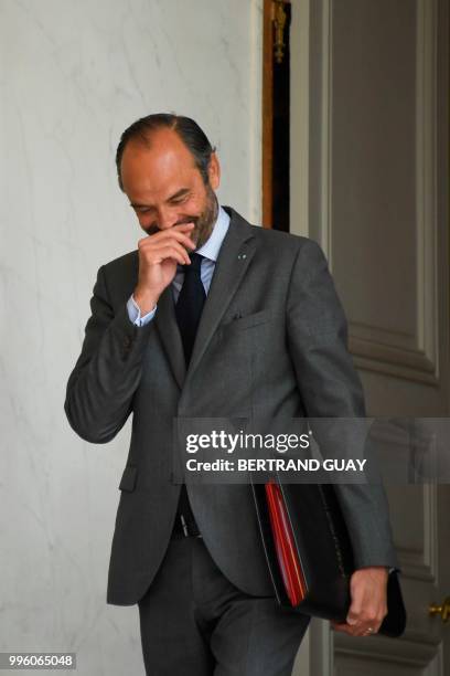 French Prime Minister Edouard Philippe gestures as he leaves on July 11, 2018 after a weekly cabinet meeting at the Elysee palace in Paris.