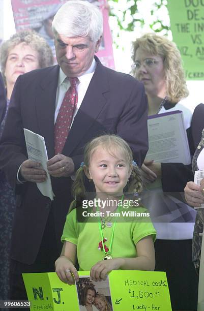 Sen. Dodd stands next to a little girl with lyme disease at a press conference that kicked of new efforts to prevent the illness.