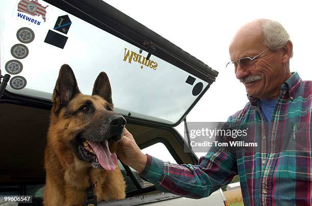 Capitol Police Dog, Fanto, gets a pat by the father of his handler Techinician Shawn Haynes near their Waldorf, Md. Home. The 11 year old German...