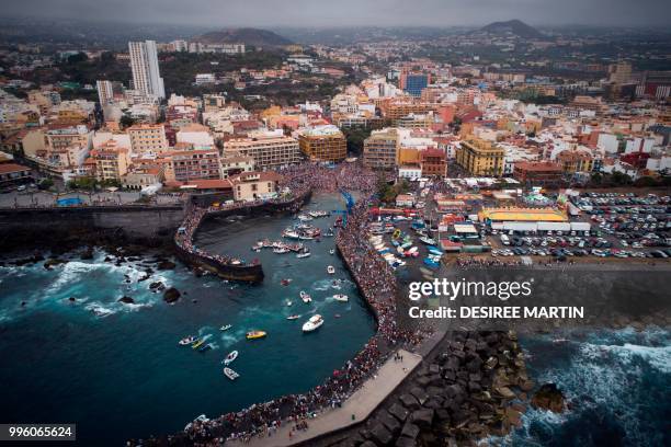 An aerial view taken with a drone on July 10, 2018 shows the Virgin del Carmen festivity, honouring the patron saint of fishermen, at Puerto de la...