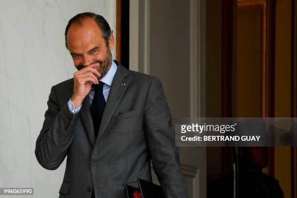 French Prime Minister Edouard Philippe gestures as he leaves on July 11, 2018 after a weekly cabinet meeting at the Elysee palace in Paris.
