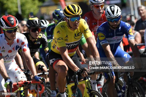 New Zealand's Dion Smith, wearing the best climber's polka dot jersey, Belgium's Greg Van Avermaet, wearing the overall leader's yellow jersey and...