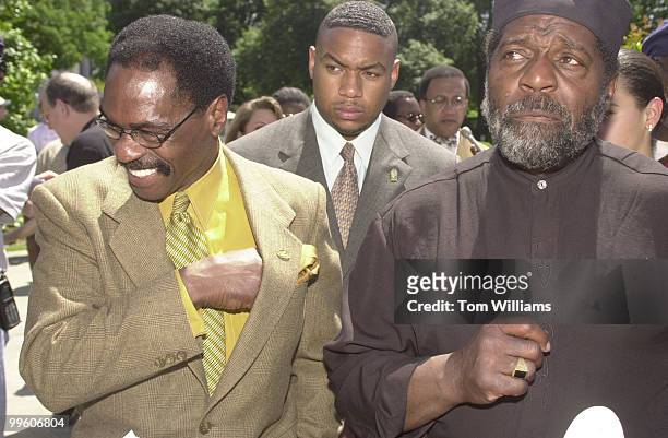 Reuben "Hurricane" Carter, left, and Darby Tillis who also spent years in prison, speak to reporters after a press conference on the granting of new...