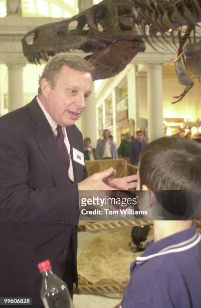 Sen. Durbin talks dinosaurs with 10 year old Bobby Kogan of VA. They, amoung others, were there to celebrate the unveiling of "Sue", a 42-foot...