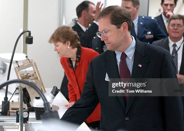 Rep. John Sununu, R-N.H., and Gov. Jeanne Shaheen, D-N.H., check out a display at the BAE Systems tour, in Merrimack, N.H.