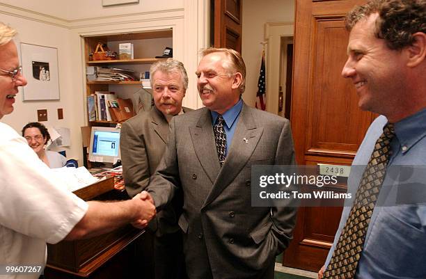 Actor John Ratzenberger from TV's "Cheers" greets, Gregory Smith, a guest in the office of Rep. Sherrod Brown, D-Ohio, right, after a meeting that...