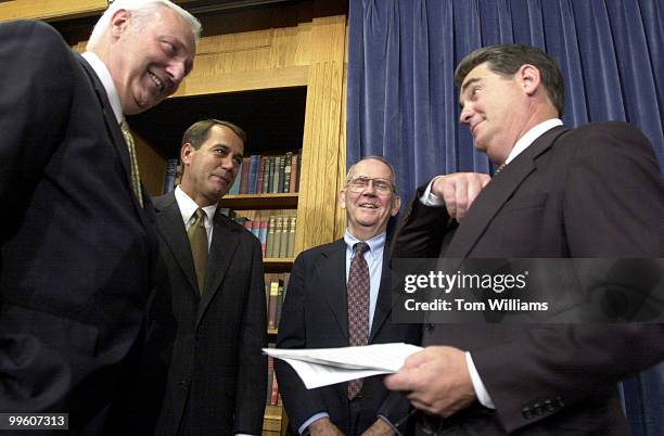 Rep. Billy Tauzin, R-LA, right, talks with Reps. John Cooksey, R-LA, before a press conference on "The Patients' Bill of Rights Act of 2001" in the...