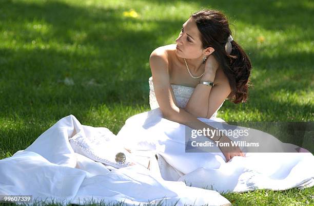 Demetra Georgiou of New York, rests after a march on Capitol Hill and the Mall to urge Congress to provide funding for the Violence Against Women Act...