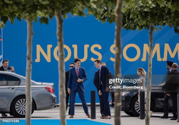 Justin Trudeau, Canada's prime minister, center, arrives at the North Atlantic Treaty Organization summit at the military and political alliance's...