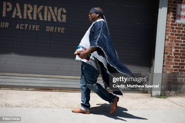 Mykel C Smith is seen on the street attending Men's New York Fashion Week wearing Shaka King on July 10, 2018 in New York City.