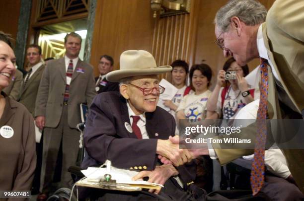 Patients activist Justin Dart is greeted by Sen. Tom Harkin, D-IA, at a rally supporting the "McCain-Edwards-Kennedy Patient Protection Act of 2001"...